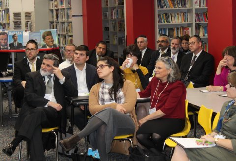 Educators listening in classroom